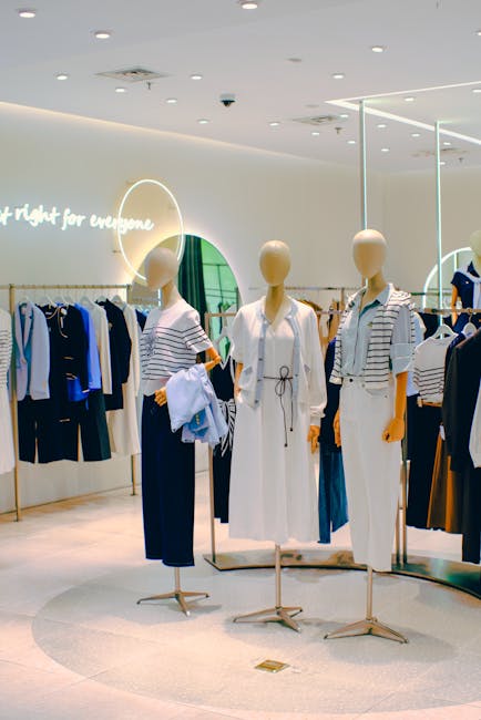 Chic clothing store interior with stylish mannequins. Elegant fashion display for retail inspiration.
